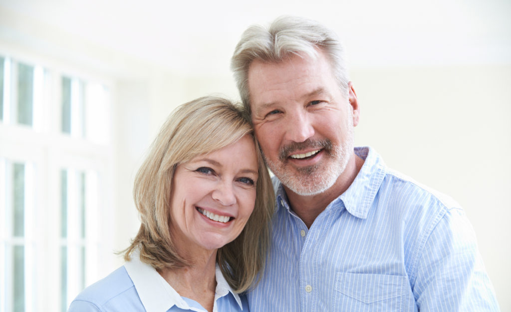 smiling elderly couple