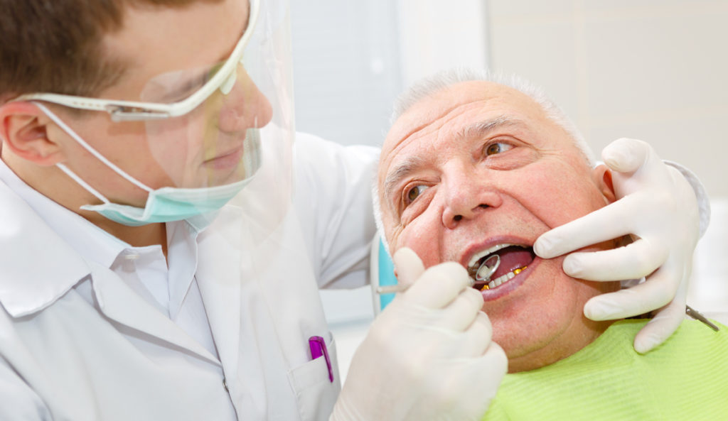 man getting gum examed