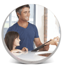 father and daughter at front desk of Pinehurst dental office