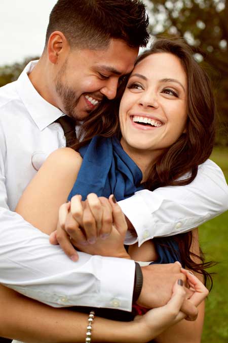 young couple laughing and smiling