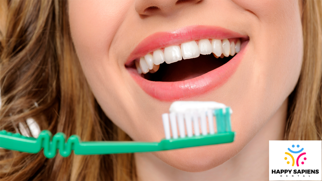 A woman brushing her teeth.